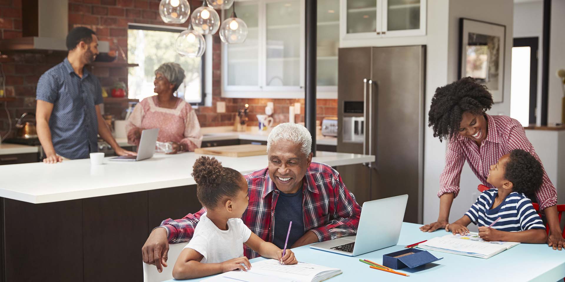 A small family in their kitchen enjoying the benefits of optimising solar systems